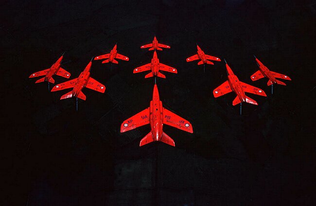 Red arrows gnats in a dive.